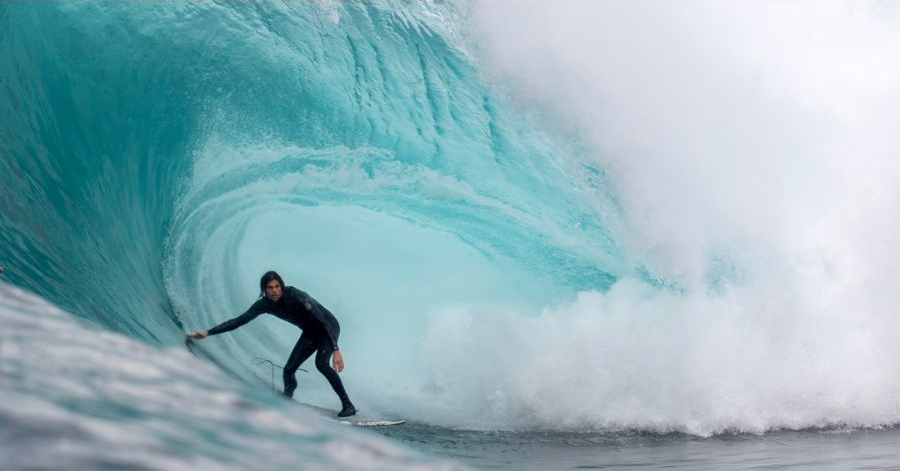 surfer wearing eco friendly winter wetsuit